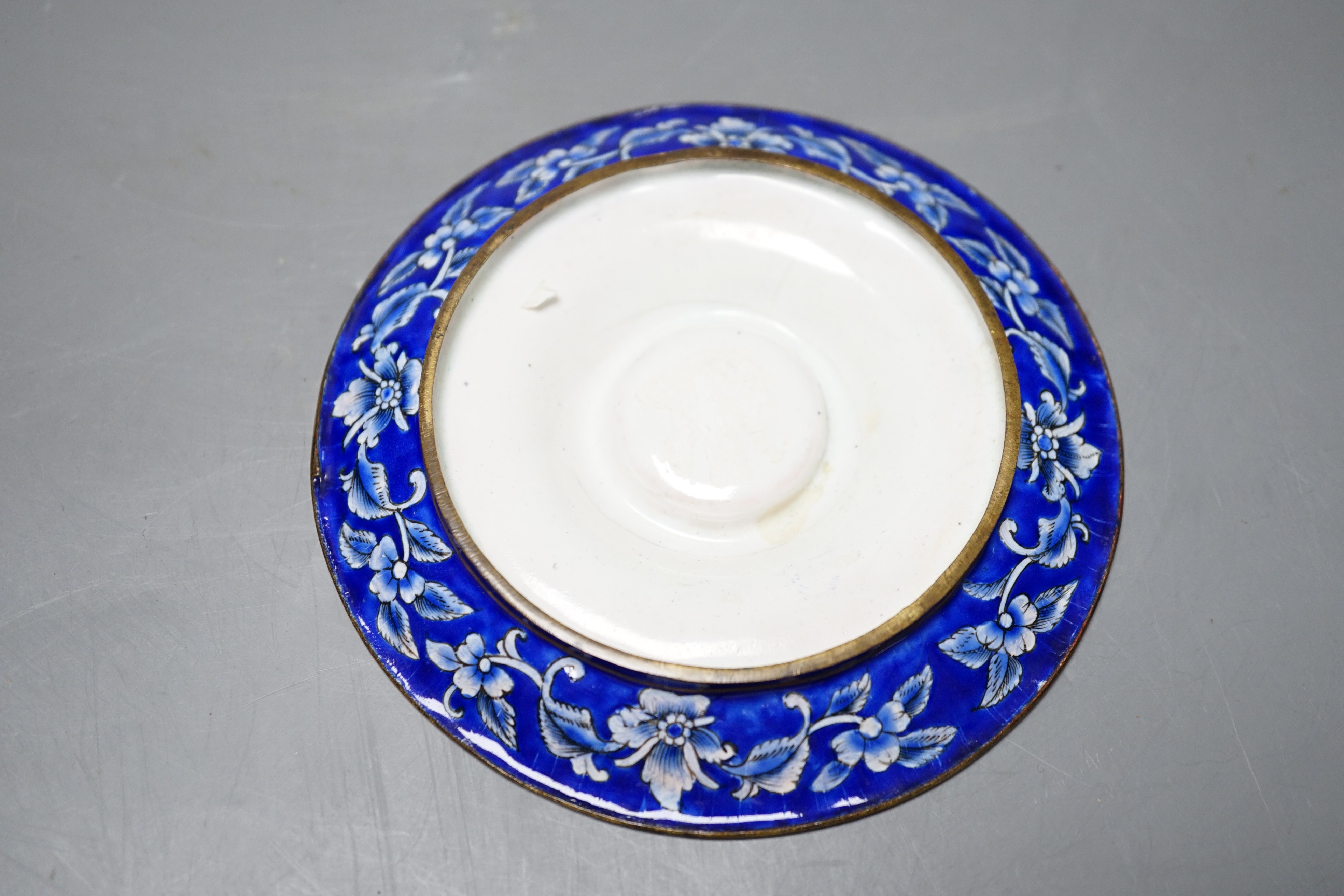 A 19th century Chinese Guangzhou enamel cup and saucer, 11cm diameter